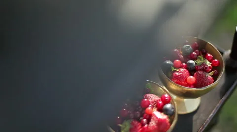 Wild berry hidef slow motion intro in beautiful saucers. Rustic style Stock Footage 51342803