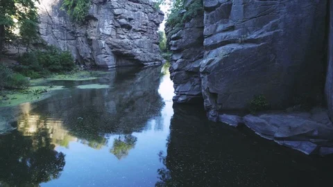 Wild brook flowing between several high rocks in the Carpathians in summer Stock Footage 99730224
