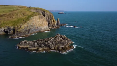 Wild cliffs of the cooper coast, waterford ireland. in drone flight with azure w Vídeos de archivo 172557211