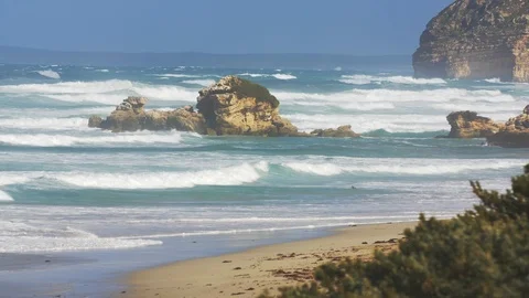 Wild coast Wild ocean waves breaking on a rock wall along the Australian Stock Footage 123036757