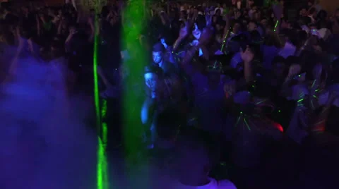 Wild crowd dancing in a outdoor disco - concert - ravers - party Stock Footage 28504811