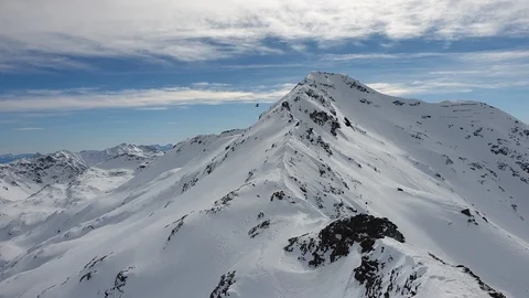 Wild eagles Flying High Above Snow Mountain Summit, Bird Soar In Blue Sky Stock Footage 128139139