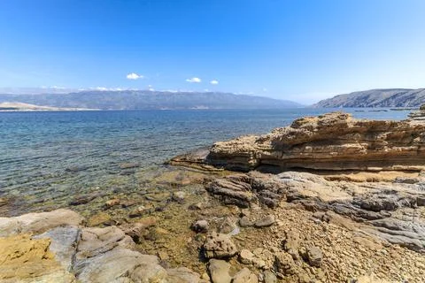 Wild empty stony beach on the Adriatic Sea Island of Rab in Croatia Stock Photos