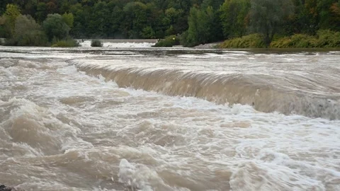 Wild flooded river flowing rapidly downstream Stock Footage 139944456