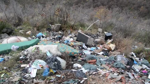 Wild garbage dump in nature. Pile of garbage. Illegal dumping Video stock 144487654