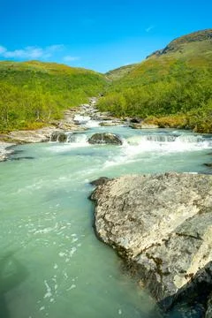 Wild glacial river winding through green remote Arctic landscape. Balgatjahka Stock Photos