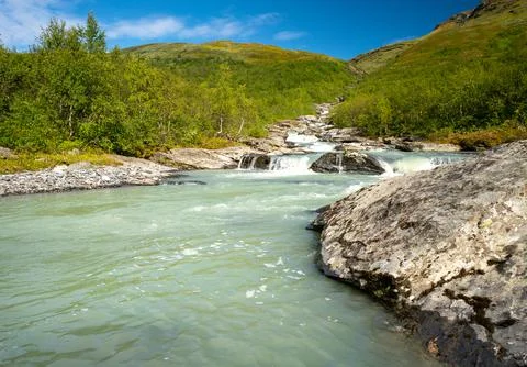 Wild glacial river winding through green remote Arctic landscape. Balgatjahka Stock Photos