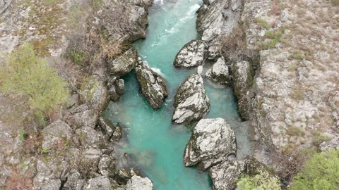 Wild green stream flowing through rocky canyon with white water rapids Stock Footage 152447975