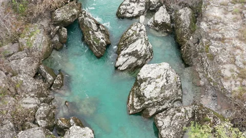 Wild green stream flowing through rocky canyon with white water rapids Stock Footage 152475227