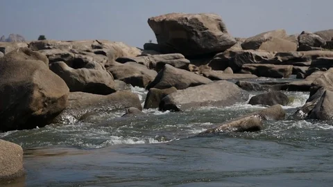 Wild Mountain River Flowing with Stone Boulders and Stone Rapids, Slowmo 動画素材 130101139