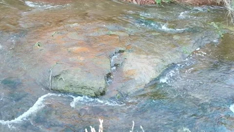 Wild mountain river flowing through stone boulders. Stock Footage 253214620
