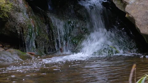Wild mountain river flowing through stone boulders. Slow motion Mountain ri.. Video stock 330788890