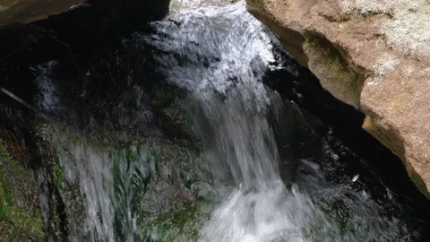Wild mountain river flowing through stone boulders. Slow motion Mountain ri.. Video stock 330789201