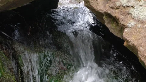 Wild mountain river flowing through stone boulders. Slow motion Mountain ri.. Video stock 330790114