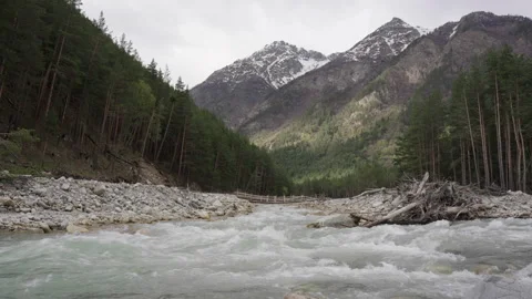 Wild mountain river running through stone rapids in Elbrus Stock Footage 197112394