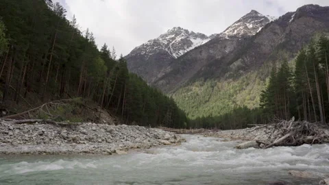 Wild mountain river running through stone rapids in Elbrus Stock Footage 197112476