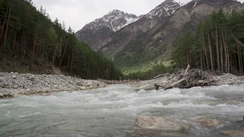 Wild mountain river running through stone rapids in Elbrus Stock Footage 197112616