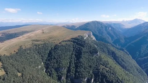 Wild mountain valley covered with forest. Caucasus, Russia Stock Footage 107697273