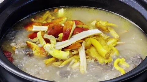 Wild Mushroom Chicken Soup - Adding Mushrooms to Pot 4K Stock Footage 340131722