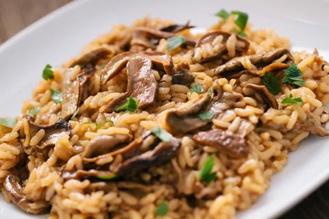 Wild Mushroom Risotto with Parmesan and Parsley Stock Photos