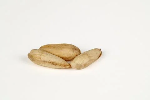 Wild papershell almonds on white Foto stock