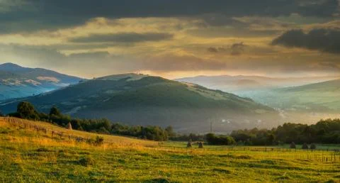 Wild plants and stack of hay at sunrise. Stock-Fotos