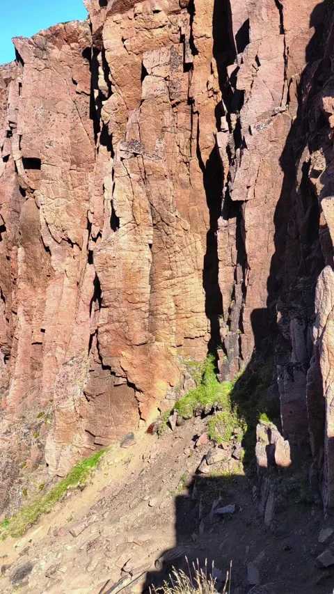Wild red-brown rocks. Red granite in nature. Natural mineral background. 動画素材 295767016