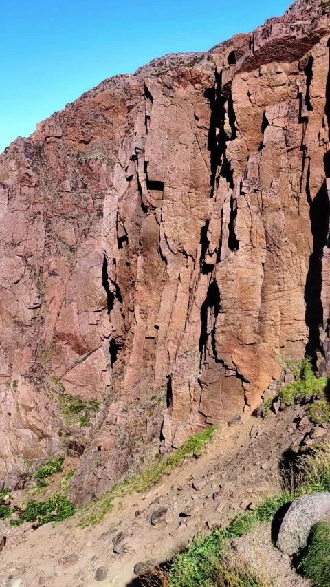 Wild red-brown rocks. Red granite in nature. Natural mineral background. Video stock 295842998
