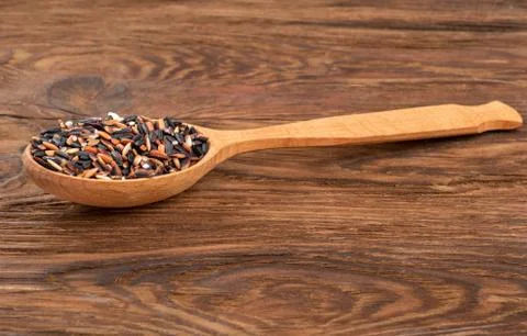 Wild rice in spoon Stock Photos