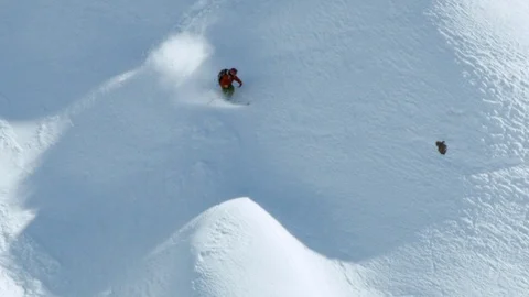 Wild ride of experienced freerider skiing down steep mountain side, Chile Stock Footage 121597724