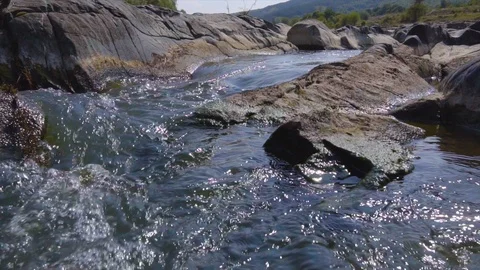 Wild river between rocks forms a beautiful natural falling waterfall stream Stock Footage 115445244
