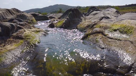 Wild river between stones forms a beautiful natural falling waterfall stream Stock Footage 115445396