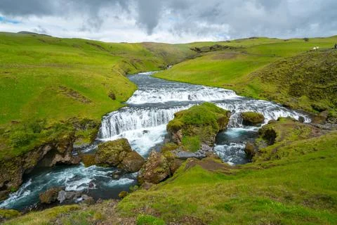 Wild river flows through green landscape in Iceland. Skoga river from Laugavegur Stock Photos