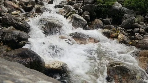 A wild river high in the mountains Видео 80558430