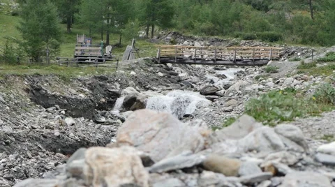 Wild River In A Mountain Valley With A Bridge Stock Footage 57321650