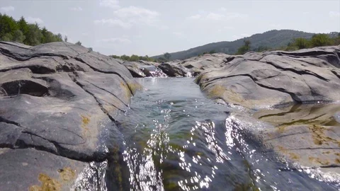 Wild river in mountains forms a beautiful natural falling waterfall stream Stock Footage 115444228