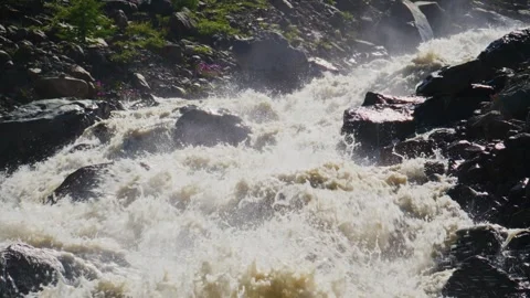 Wild river roars through rocky terrain 스톡 동영상 346389544