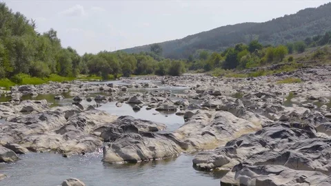 Wild river stream flows between the stones and forms a beautiful waterfall Stock Footage 115445450