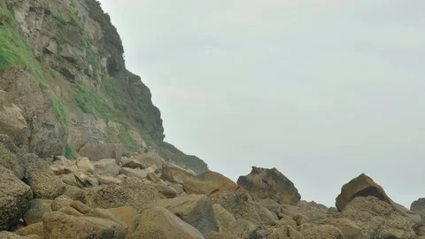Wild rocky beach overcast at the cloudy day Stock Footage 95540141