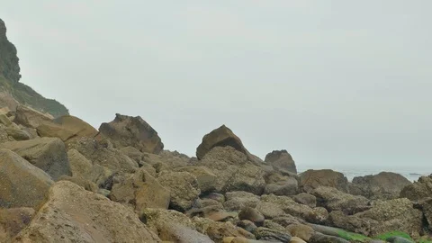 Wild rocky beach overcast at the cloudy day Stock Footage 95540314