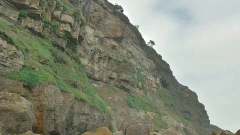 Wild rocky beach overcast at the cloudy day Stock Footage 95540916