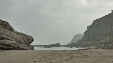 Wild rocky beach overcast at the cloudy day Stock Footage 95546010