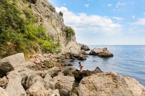 Wild rocky beach. Stock Photos