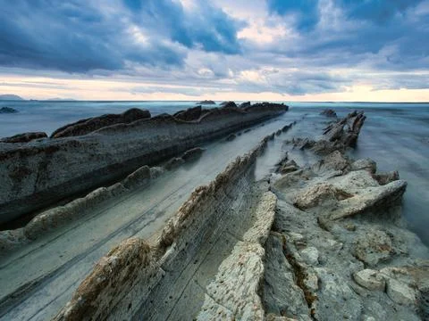 Wild rocky coast with dramatic cloudy skies - A long exposure of a natural .. Stock-Fotos
