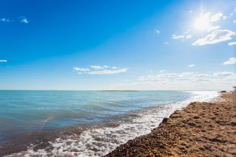 Wild sandy shore of Lake Balkhash. Summer in Kazakhstan Stock Photos