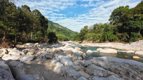 Wild Stone Riverbed looks powerful. Crystal water flows over Wild Stone Riverbed Stock Footage 326596798