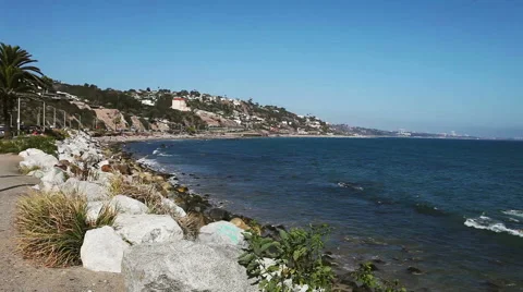 Wild stone shore or coast with waves of the Pacific ocean on Malibu, California Stock Footage 54978173
