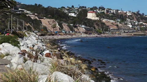 Wild stone shore or coast with waves of the Pacific ocean on Malibu, California Stock Footage 54978775