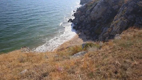 Wild stormy sea bay with cliffs around Stock Footage 79622902
