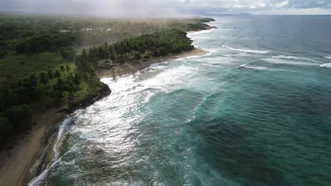 Wild Tropical Beach with Strong Waves and Lush Jungle. Aerial View Stock Footage 314805082